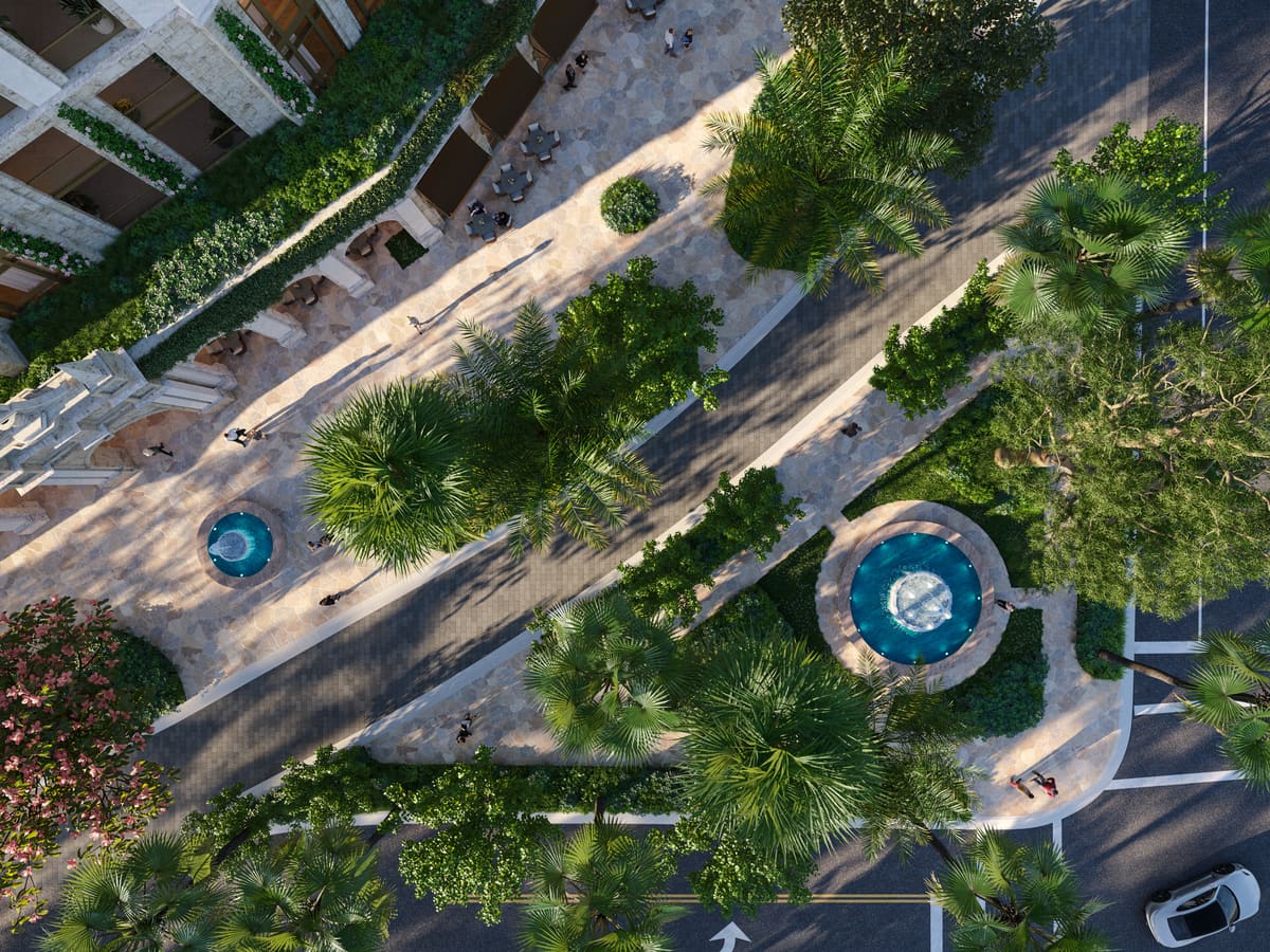 Aerial view of Ponce Park Residences showing the rooftop pool deck and the courtyard gardens below