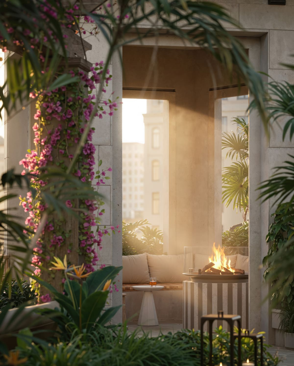 An outdoor fire pit at Ponce Park Residences, framed by stone columns and flowering bougainvillea
