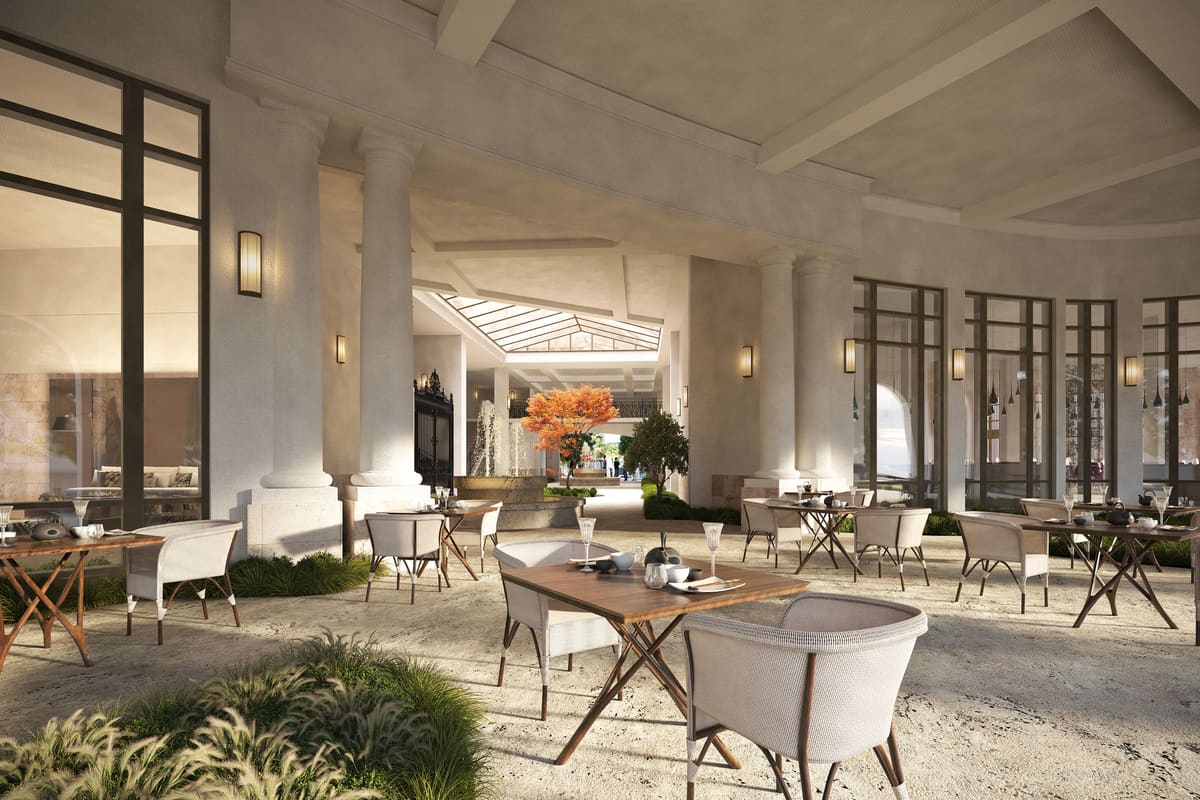 The open-air paseo at Ponce Park Residences, a covered walkway with café seating and garden beds