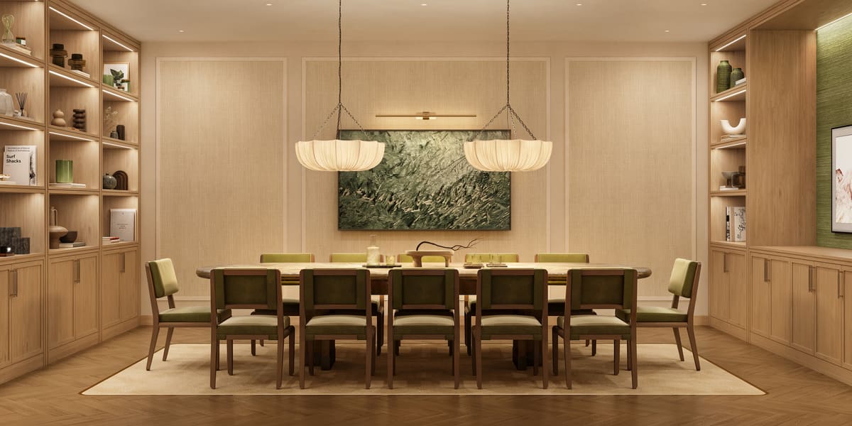 The private dining room at Ponce Park Residences, a single long table beneath twin pendant shades