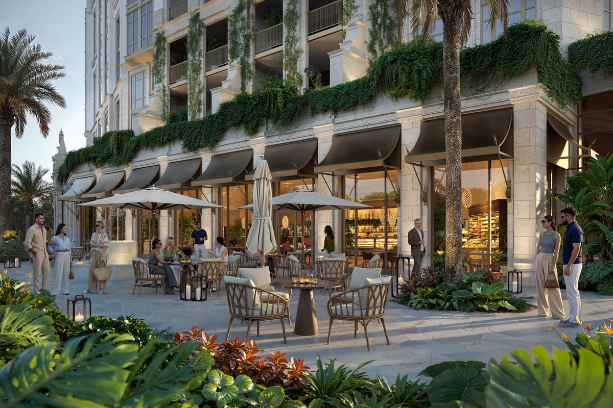Ground-floor restaurant terrace at Ponce Park Residences, with awnings and pavement seating along the paseo