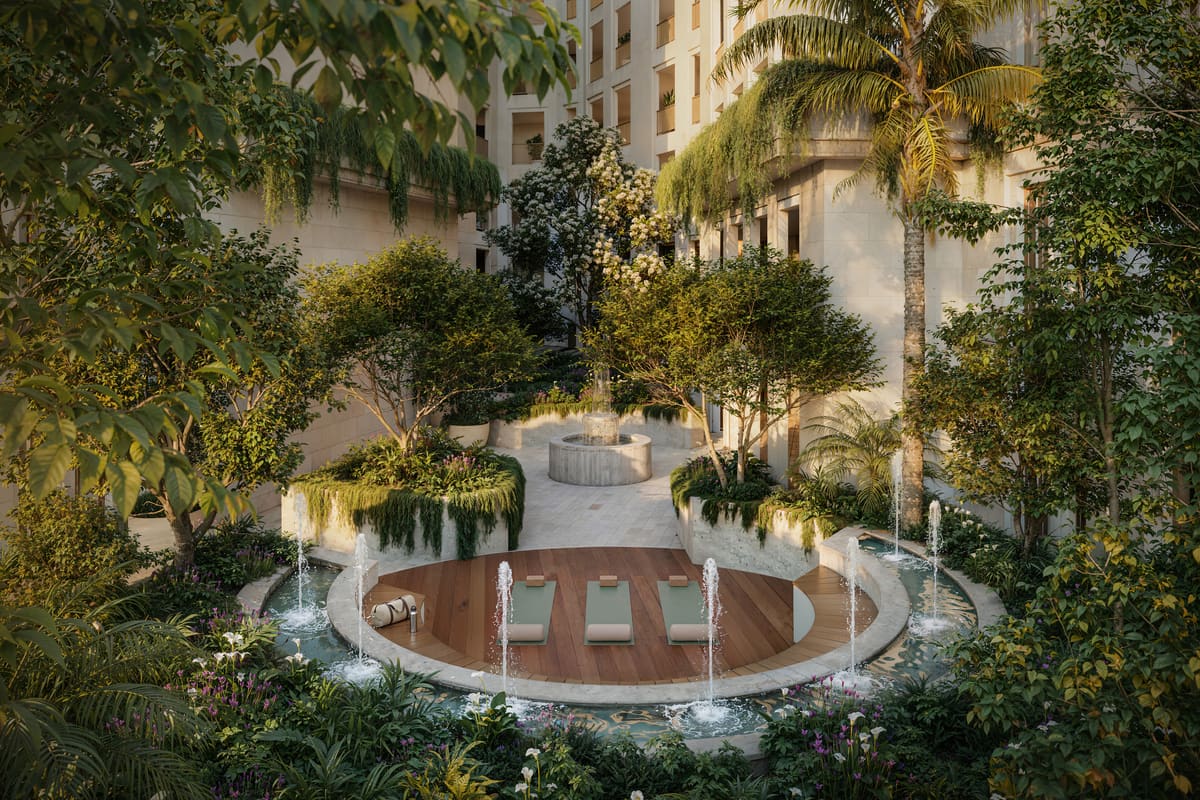 The Zen Garden courtyard at Ponce Park Residences seen from above, with loungers set around a reflecting pool